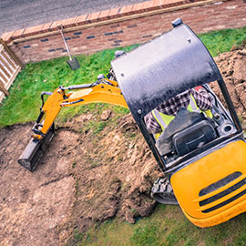 Arial shot of a mini digger with digger hire insurance